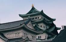 white and green temple under white sky during daytime © Aryan Athalye 