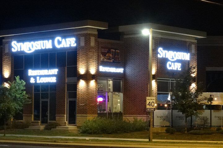 Symposium Cafe Restaurant Keswick Logo