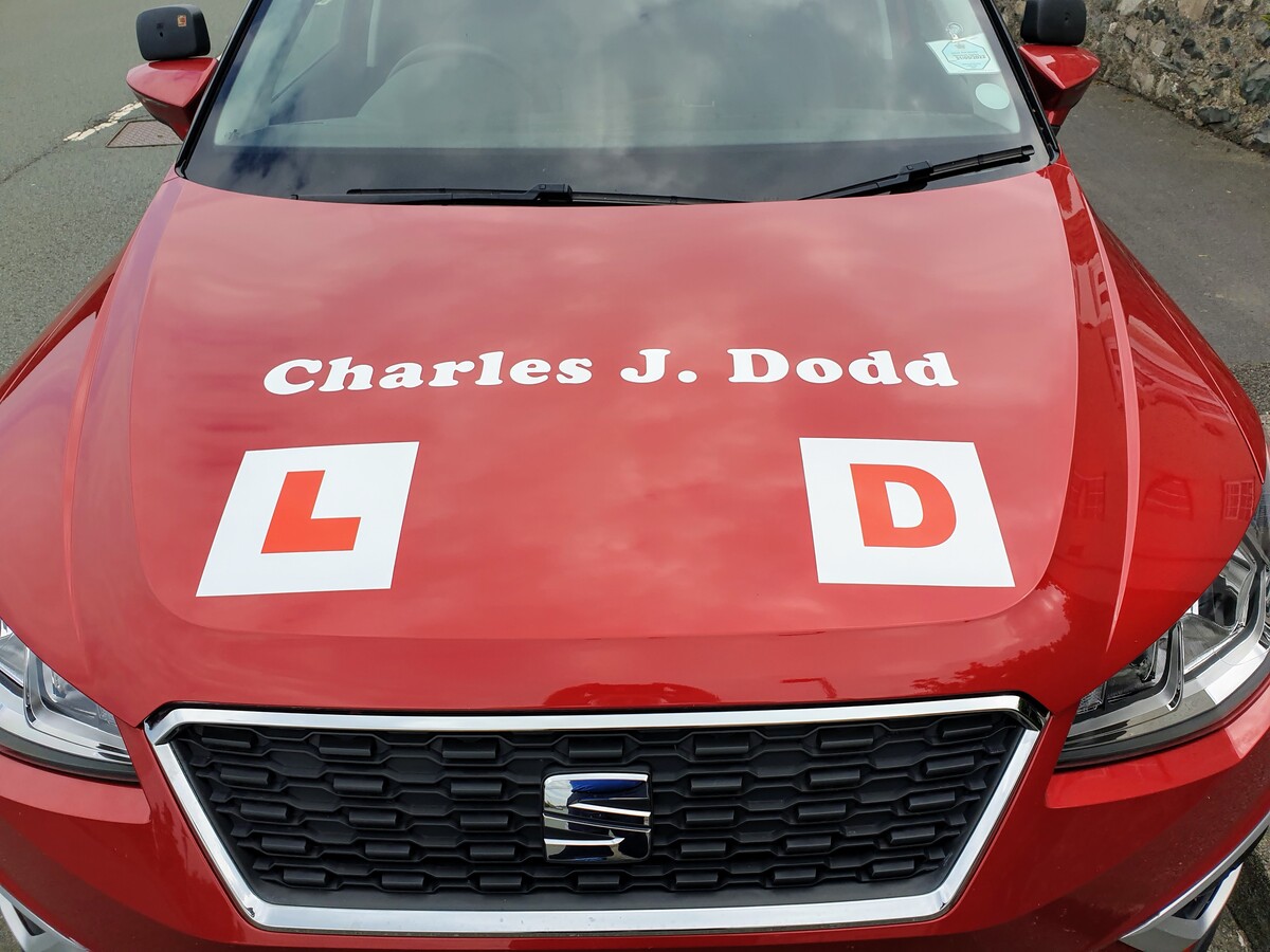 Charles J. Dodd Driving School Logo