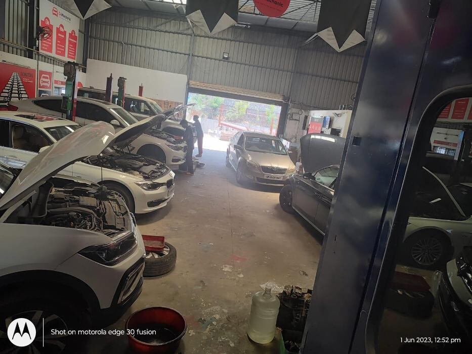 Images i Car Service -The Premier Car Service Center