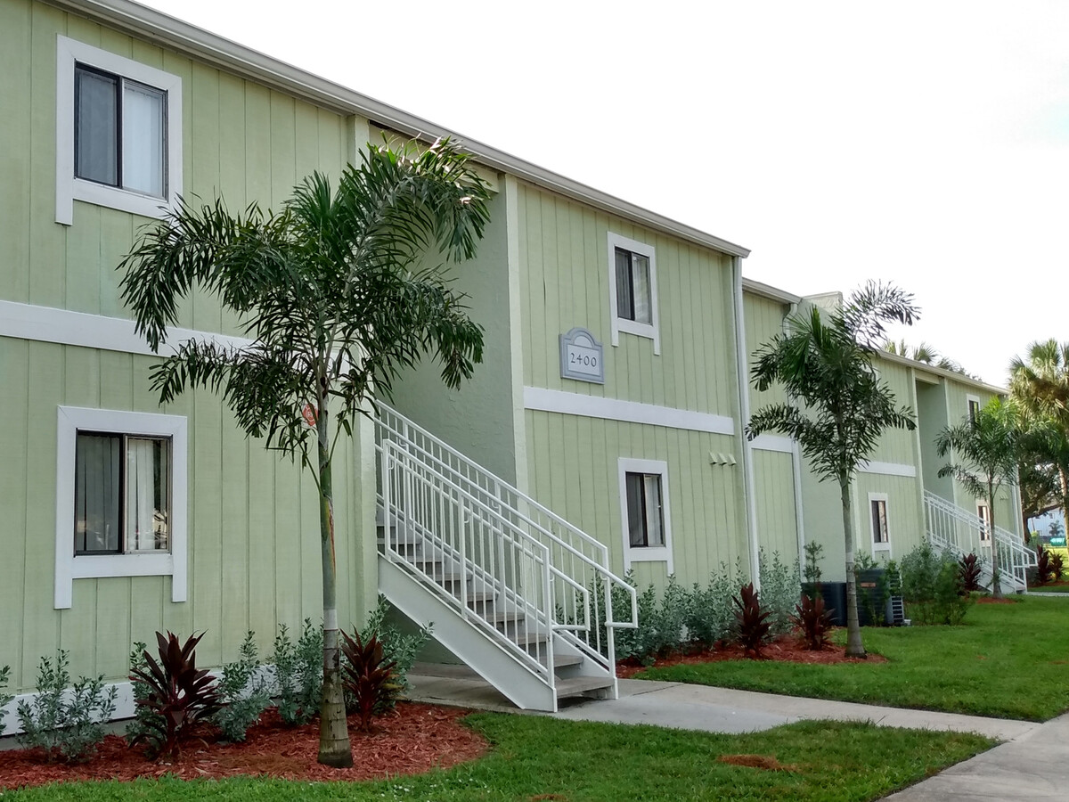Woodlake Village Apartment Homes Logo