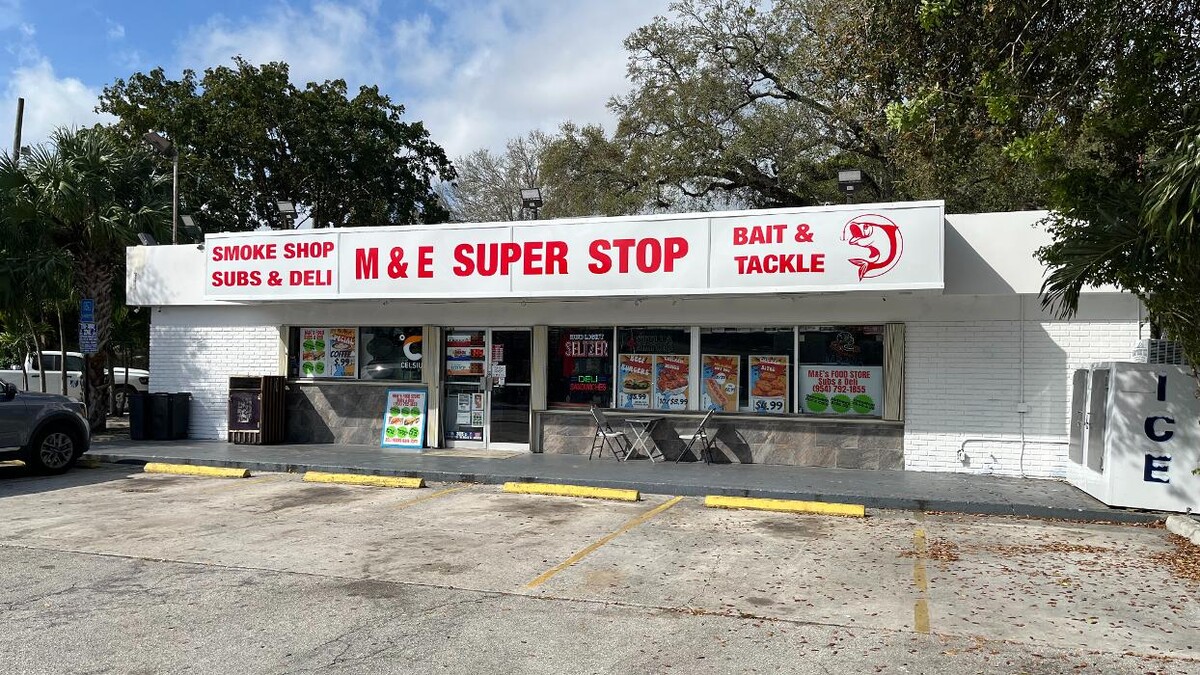 M & E SUPER STOP Logo
