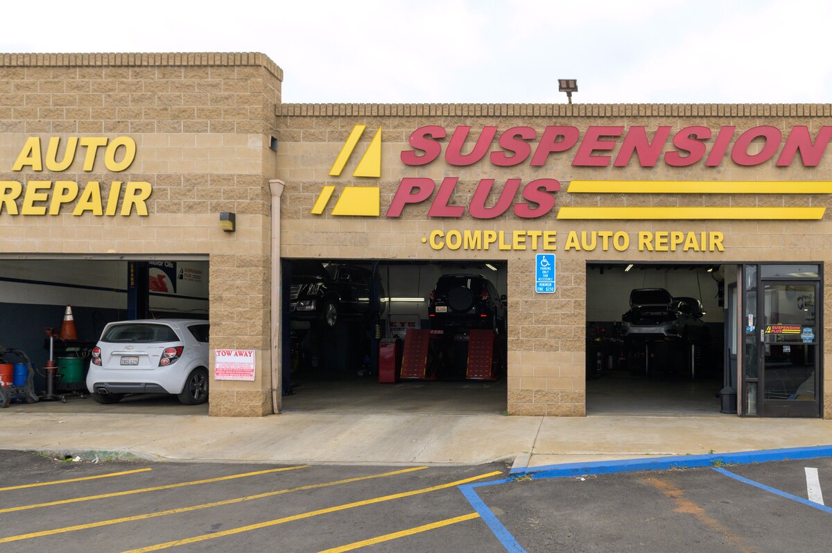 Suspension Plus Automotive Repair Logo