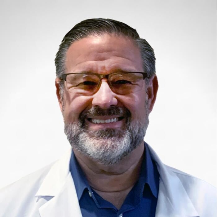 Dr. Douglas Rediger DDS Logo