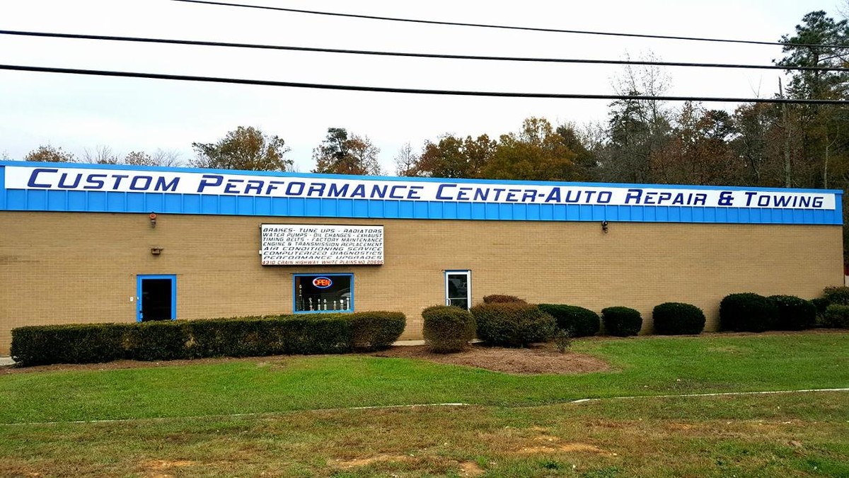 Custom Performance Center Auto Repair & Towing Logo