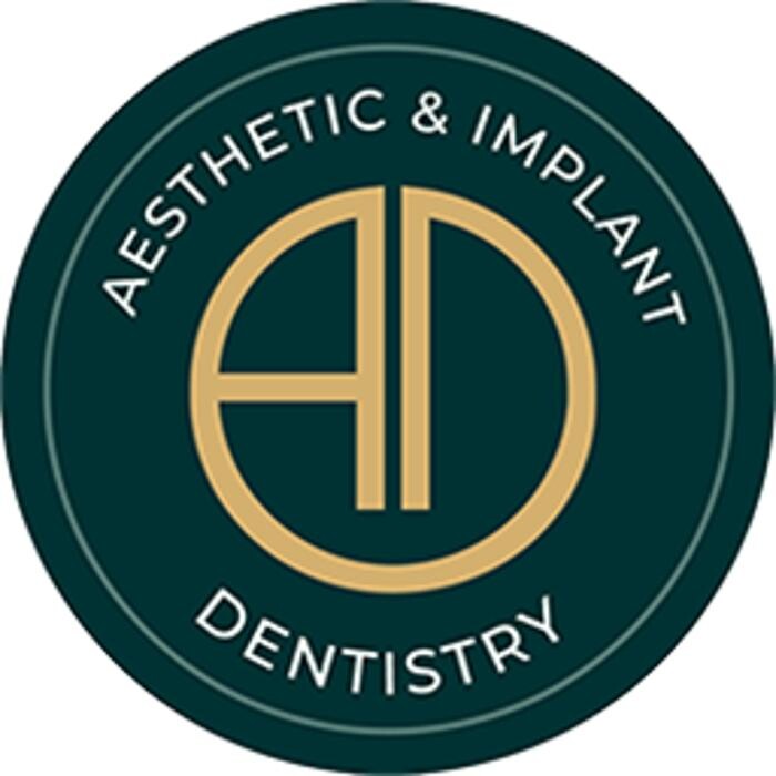 Aesthetic & Implant Dentistry Logo