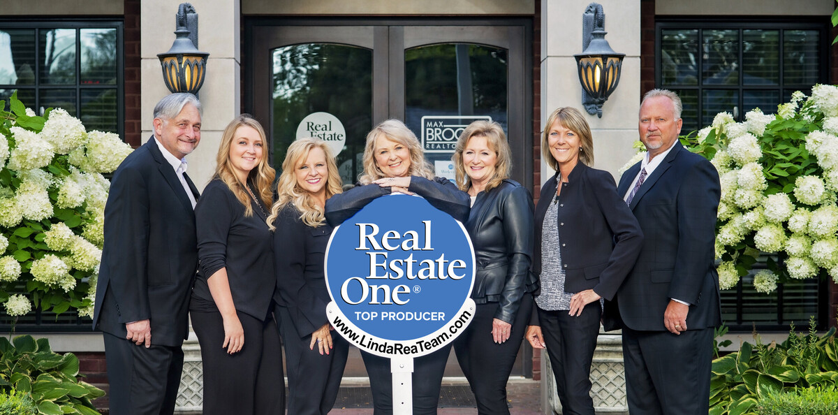 Linda Rea Team of Real Estate One Logo